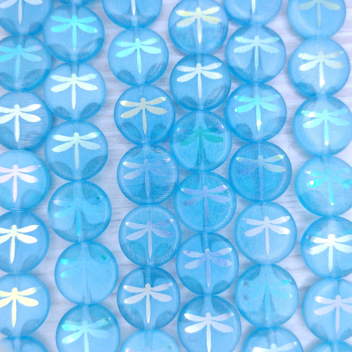 8 x 14mm discs in Milky Blue and crystal with laser etched Dragonfly