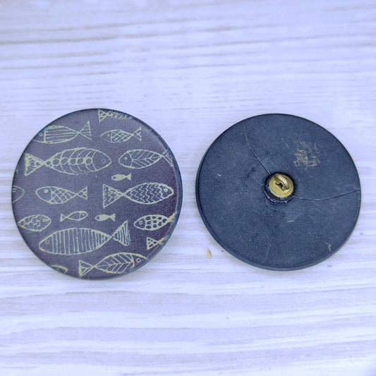 36mm glass button in Matt Black with Laser Etched Fish designed by Dora Davies