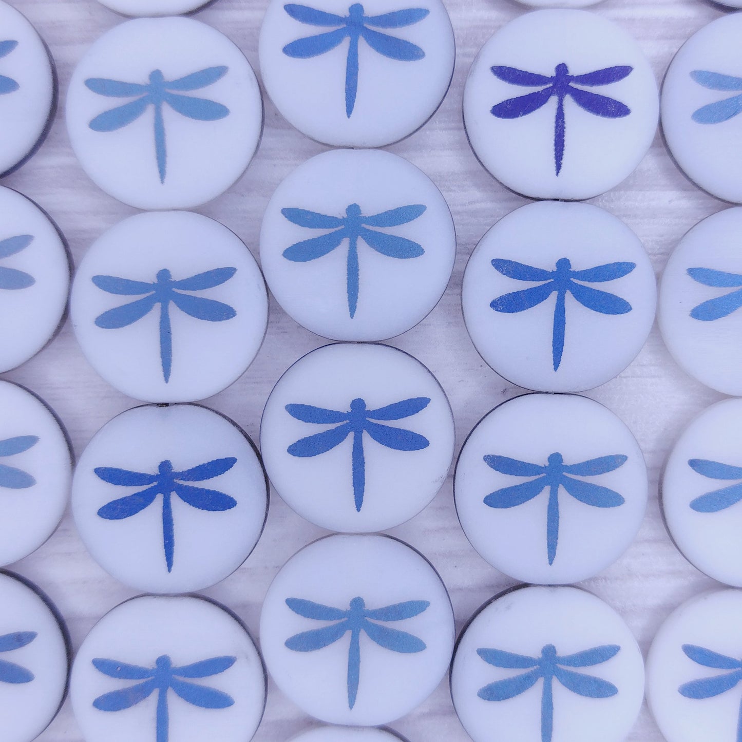 8 x 16mm discs in Matt White with laser etched Blue dragonflies