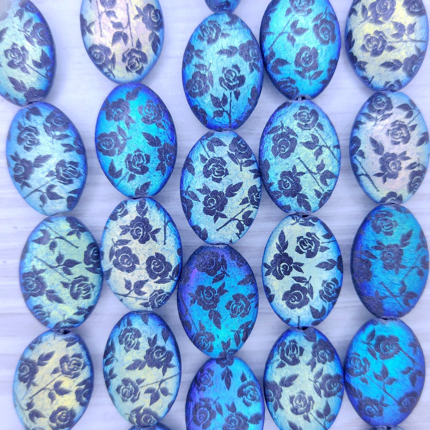 6 x puffed oval beads in etched Black with laser etched Flowers (18x13mm)