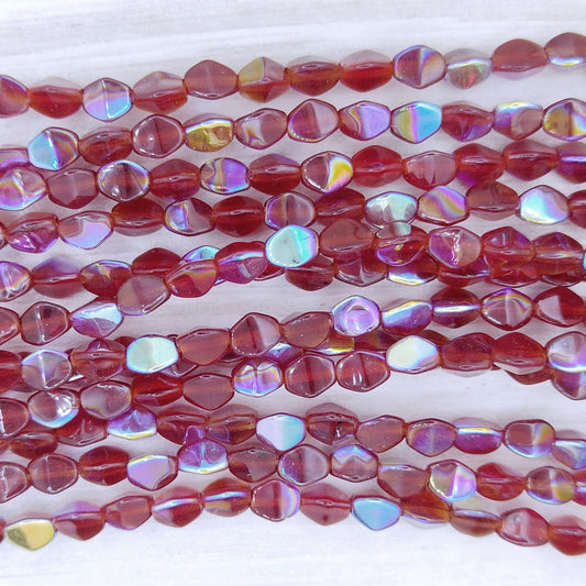 44 x Pinch beads in Dark Red AB (3x5mm)