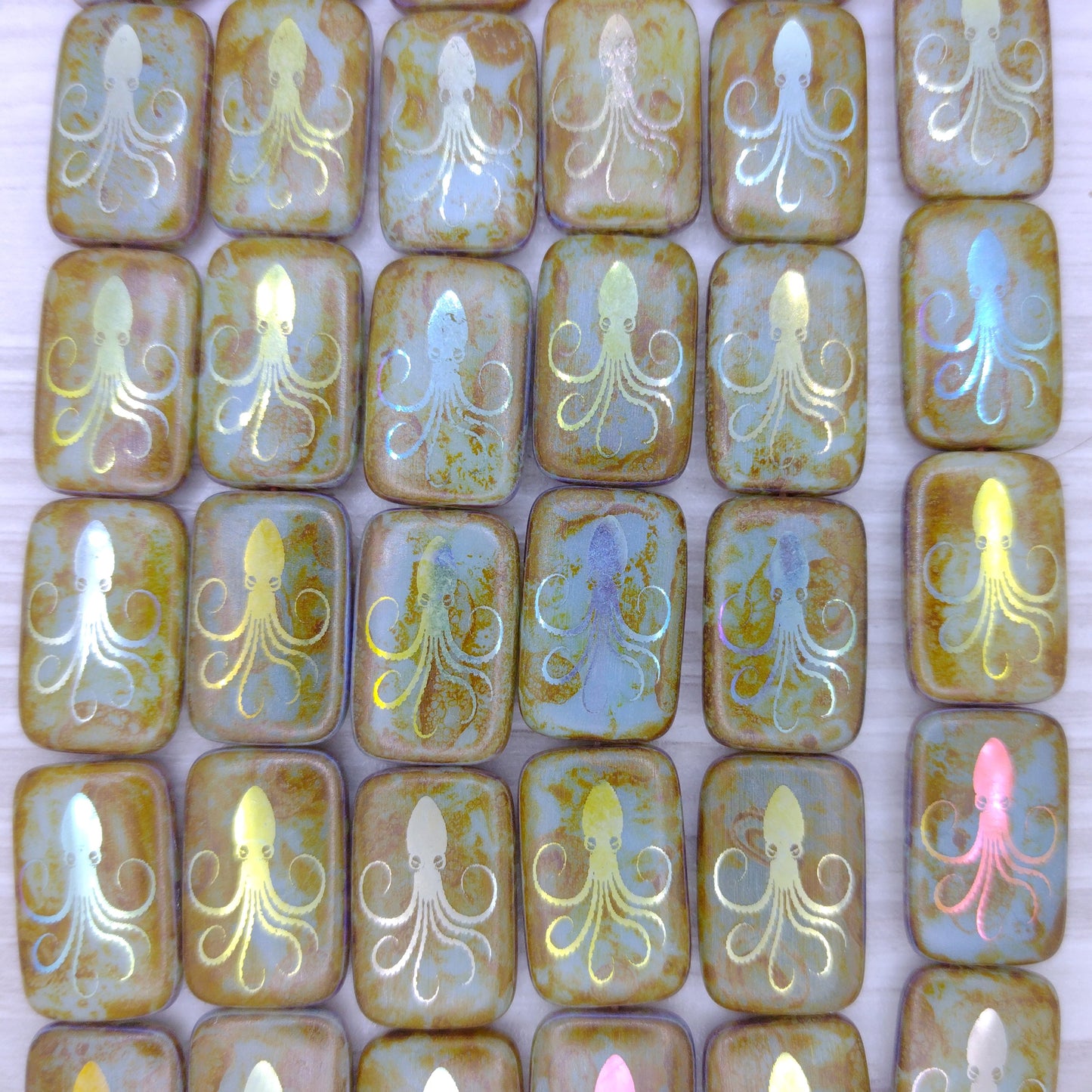 6 x rectangular beads in Aqua Picasso with laser etched Octopus (18x12mm)