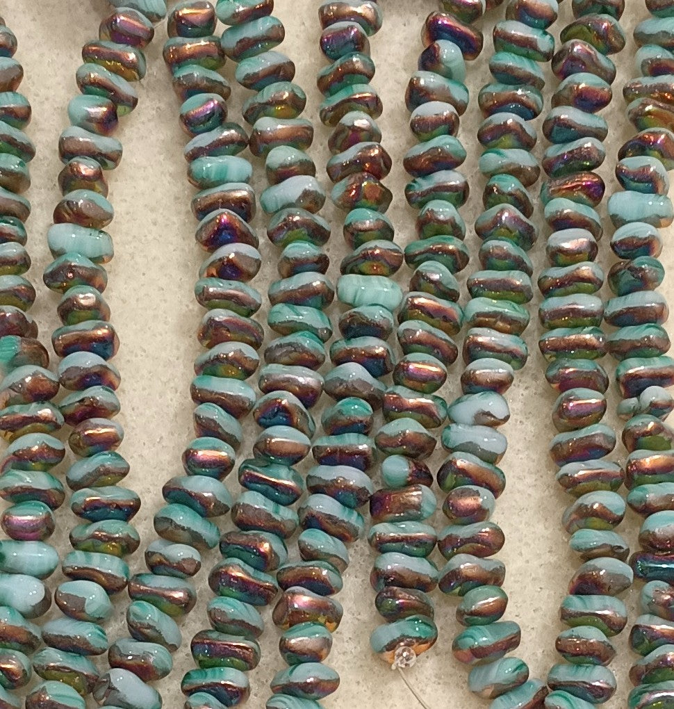 25 x shaped triangular beads in Turquoise Sliperit (7x5mm)