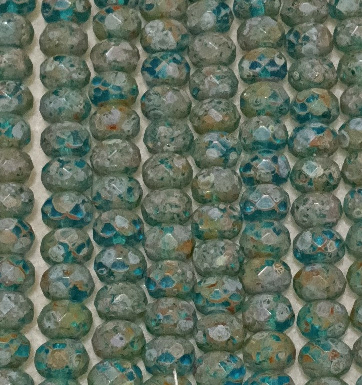 25 x faceted rondelles in Green Turquoise Picasso (6x9mm)