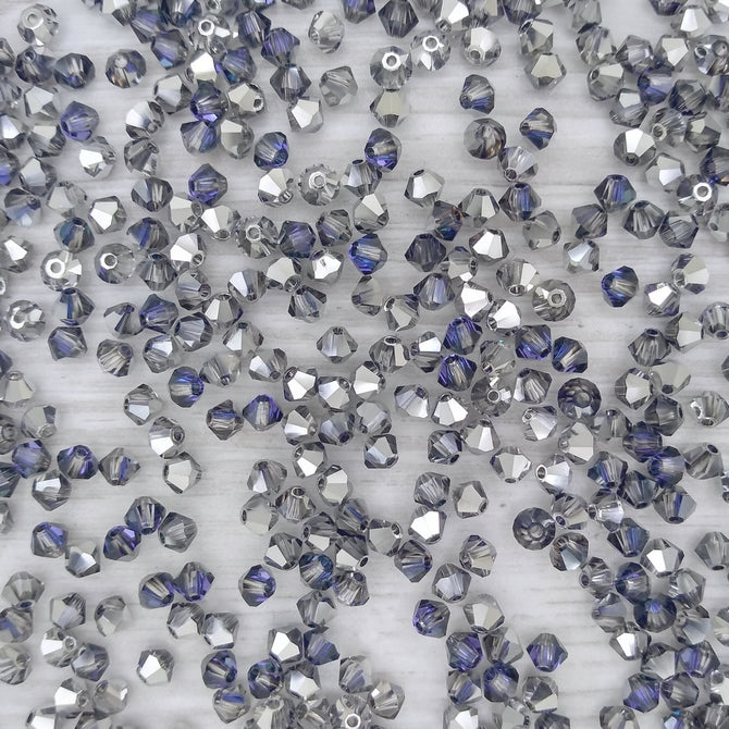 24 x 4mm bicones in Crystal Heliotrope (Preciosa)