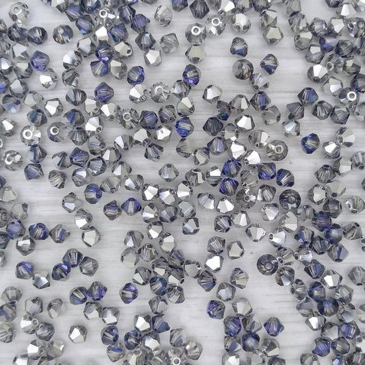 24 x 4mm bicones in Crystal Heliotrope (Preciosa)