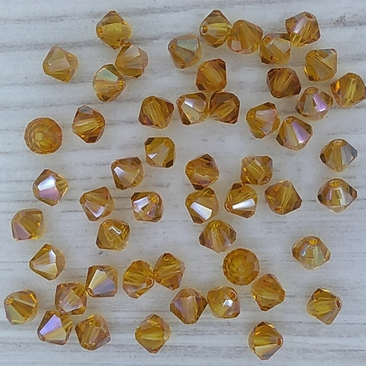 25 x 4mm bicones in Topaz AB (Czech)