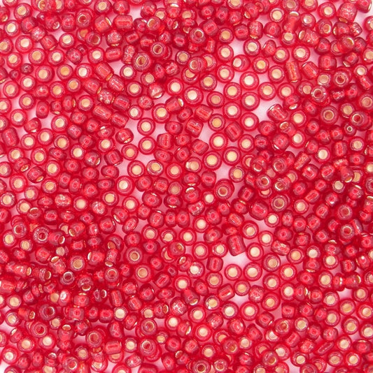 10g uneven size 11/0 seed beads in Silver lined Red