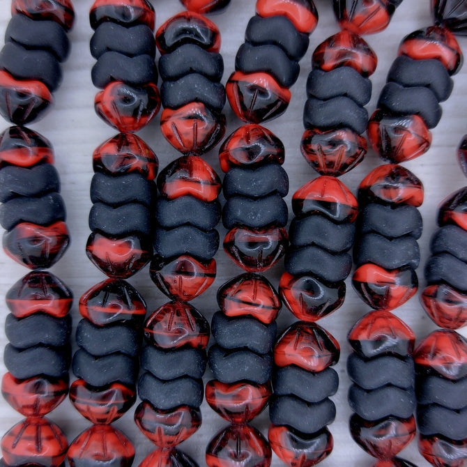 String of shaped beads in Matt Black and Red