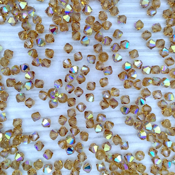 24 x 4mm bicones in Light Colorado Topaz AB (Preciosa)