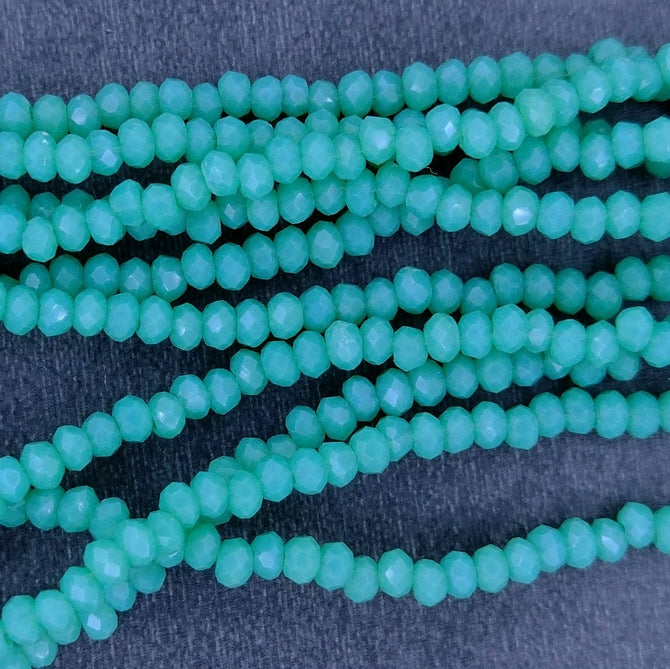 200 x 1mm Chinese cut beads in Pacific Green