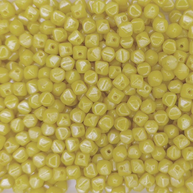 50 x 4mm pressed bicones in Yellow Shimmer