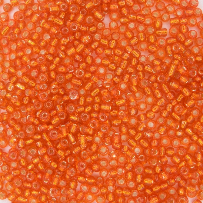 10g uneven size 11/0 seed beads in Silver lined Orange