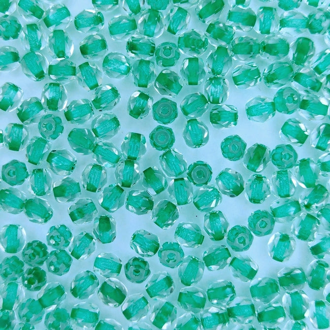 50 x 4mm faceted beads in Green lined Crystal