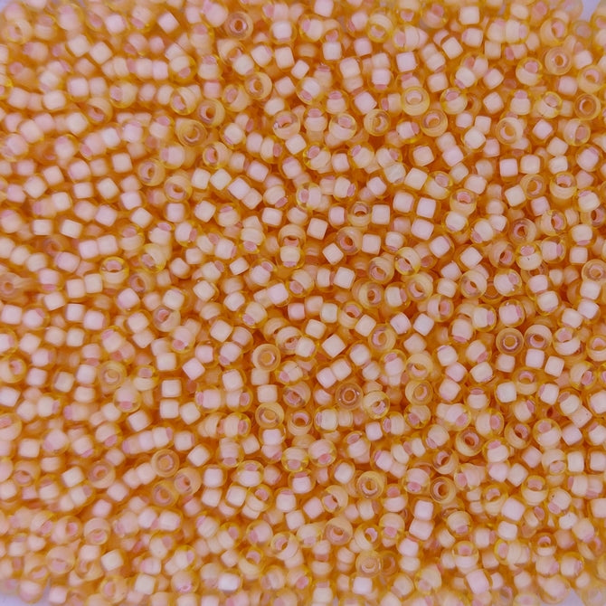 1922 - 50g Size 11/0 Miyuki seed beads in SF Peach lined Light Topaz