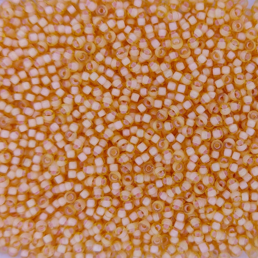 1922 - 50g Size 11/0 Miyuki seed beads in SF Peach lined Light Topaz