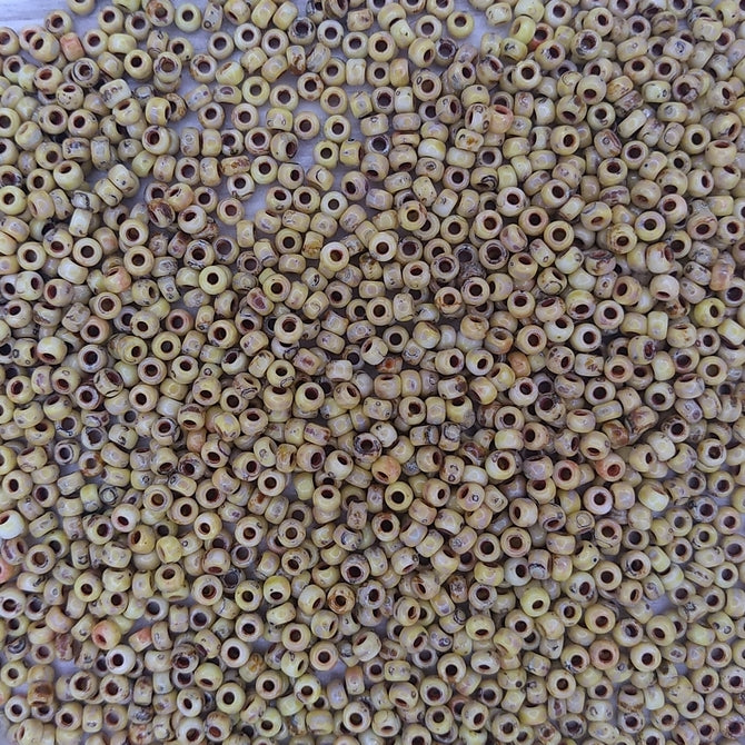 4512 - 50g Size 8/0 Miyuki seed beads in Opaque Canary Yellow Picasso