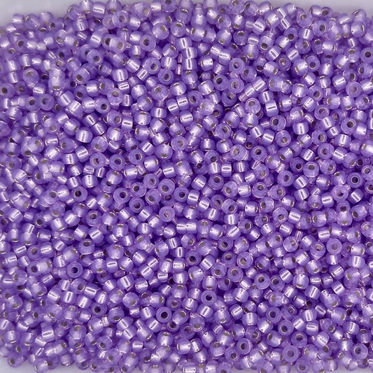 0574 - 50g Size 11/0 Miyuki seed beads in Silver lined Alabaster Dyed Lilac