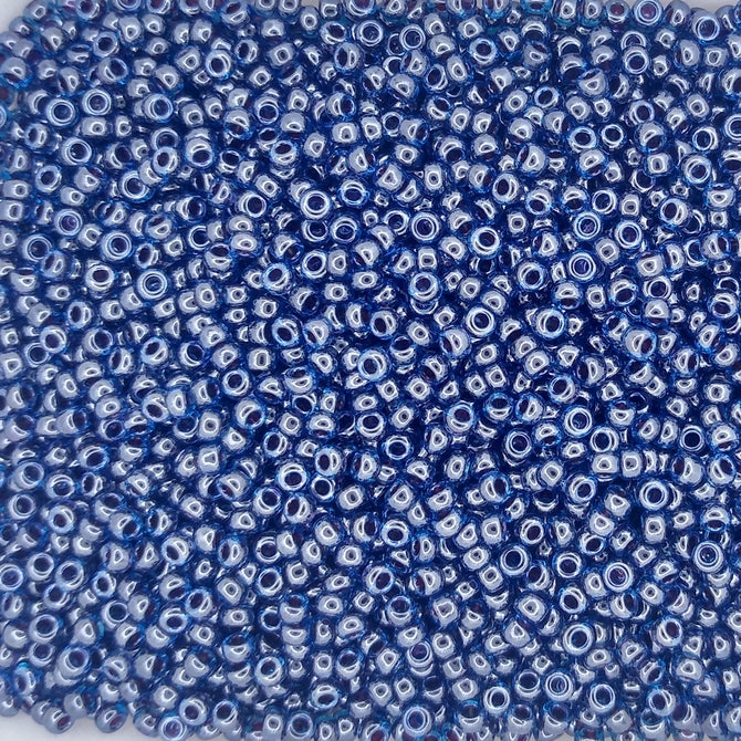 0358 - 50g Size 11/0 Miyuki seed beads in Ruby lined Capri Blue Lustre